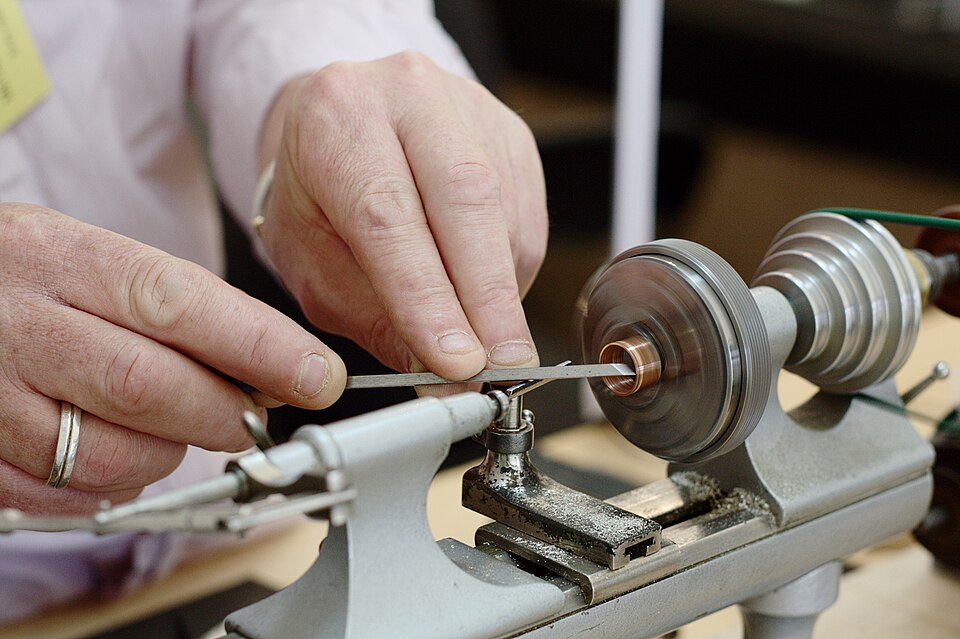 Precision metalworking equipment machining a copper component