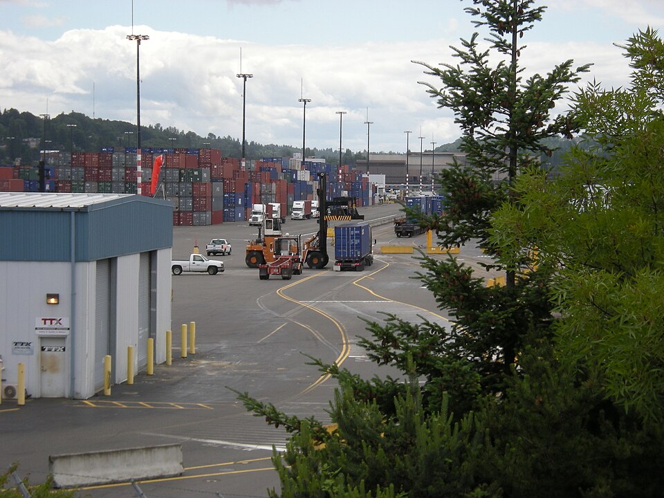 Shipping containers and equipment moving through a freight terminal